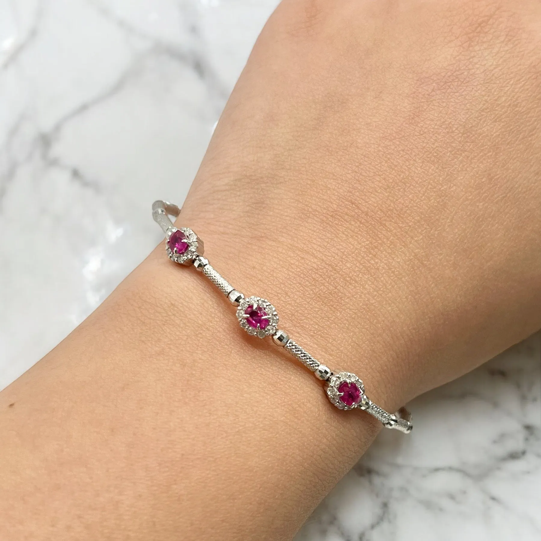 STRETCHABLE WHITE GOLD OVAL RUBY BANGLE